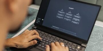 Freelancer using AI tools on laptop to make money online